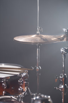Drum set in a dark room against the backdrop of the spotlight. Atmospheric  background symbol of playing rock or jazz drums. Stock Photo | Adobe Stock