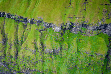 Aerial view of Koltur island in Faroe Islands, North Atlantic Ocean. Photo made by drone from above. Nordic Natural Landscape.