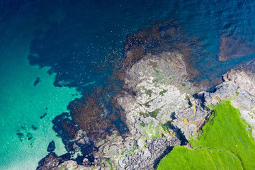 Aerial view of Koltur island in Faroe Islands, North Atlantic Ocean. Photo made by drone from above. Nordic Natural Landscape.