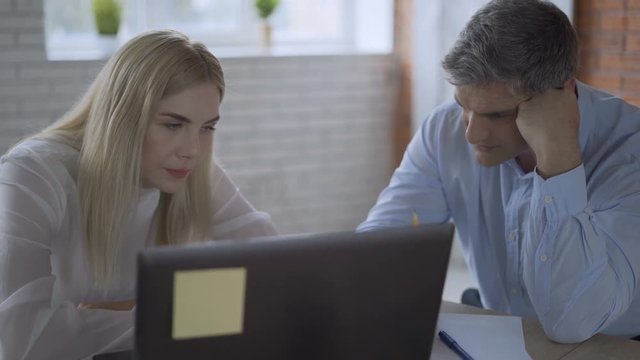 two upset businessmen in the office worry about the future of the company. partners fiasco deal bargain 4K