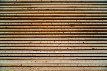 Stack of natural rough wooden boards. Wooden boards, lumber, industrial wood.