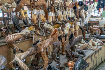 Street market in Tbilisi. On the ground horns for drinking wine close-up. Antique items