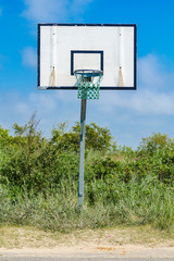 old lonely basketball basket on the roadside