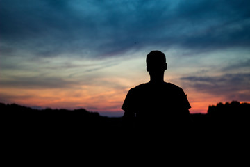 Silhouette of a man in the colorful sunset