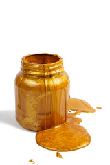 Pouring golden paint on the can