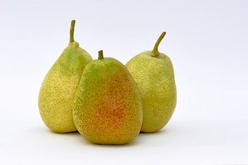 Closeup view of three pears on a white background