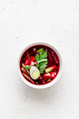 Summer cold beet soup with eggs, cucumber, potatoes and greens