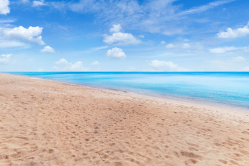 Beautiful tropical beach and sea on blue sky background with copy space for text