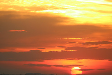 sunset on red yellow sky back soft evening cloud over horizon sea