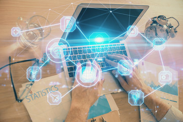 Social network theme hologram with businessman working on computer on background. Concept of world wide web. Double exposure.