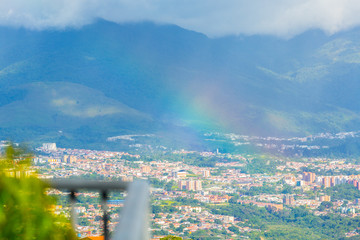 A little rain falls on the city of San CRistobal during the afternoon and a rainbow appears