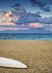 Holy mount Athos from Sarti, Sithonia, Halkidigi, Greece, late afternoon, boat on the sandy beach
