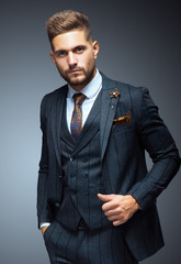 Stylish young man in suit and tie. Business style. Fashionable image. Office worker. Sexy man...