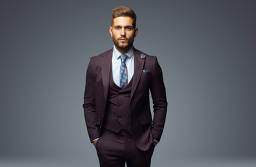 Stylish young man in suit and tie. Business style. Fashionable image. Office worker. Sexy man...