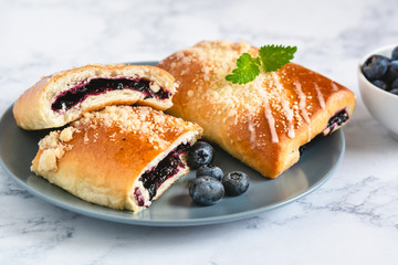 Traditional polish yeast cake with blueberries (jagodzianka).