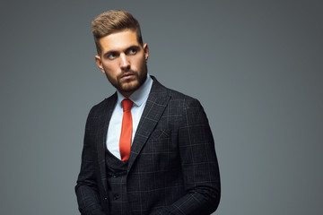 Stylish young man in suit and tie. Business style. Fashionable image. Office worker. Sexy man...