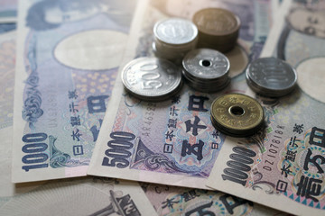 Japanese yen notes and Japanese yen coins for money concept background.