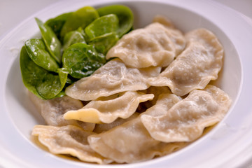 Dumplings made in a dish with spinach