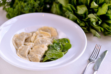 Dumplings made in a dish with spinach