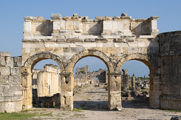 Turkey: the Frontinus Gate, the monumental entrance to the Roman city of Hierapolis (Holy City), the ancient city located on hot springs in classical Phrygia whose ruins are near Pamukkale  