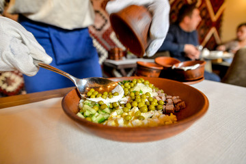 cooking olivier mixing in a large dish