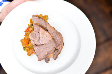 meat in a white plate dish