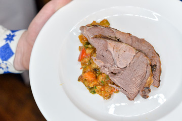meat in a white plate dish