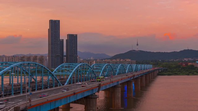 Seoul City skyline at Dongjak Bridge and Han river in Seoul, South Korea. TL Day to night