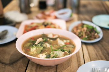 Spicy meal with tom yam kung soup, som tam and larb