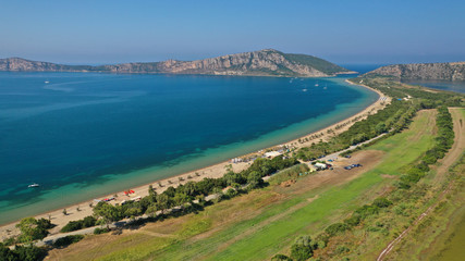 Fototapeta na wymiar Aerial drone photo of iconic sandy beach of Divari (chrysi akti) with emerald sea near island of Sfaktiria in bay of Navarino, Messinia, Gialova, Peloponnese, Greece