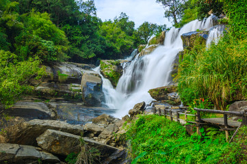 Beautiful waterfall in green forest shoot by slow shutter speed to make the water look softer,Mae...
