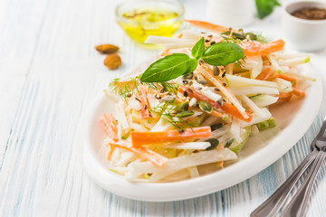 Root vegetablesa salad on wooden background. Selective focus, space for text