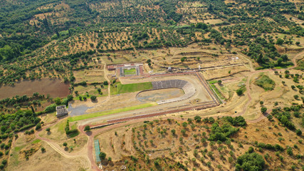 Aerial drone photo of unique and well preserved archaeological site and citadel of Ancient Messene featuring massive stadium and theatre, Messinia, Peloponnese, Greece