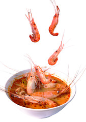 boiled shrimp falling in Thai spicy soup or tom yum kung on bowl