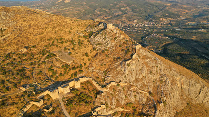 Fototapeta na wymiar Aerial drone panoramic view of iconic uphill medieval castle of Acrocorinth an ancient citadel overlooking ancient Corinth, Peloponnese, Greece