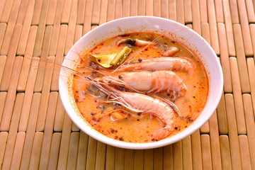 boiled shrimp with herb in Thai spicy soup or tom yum kung on bowl