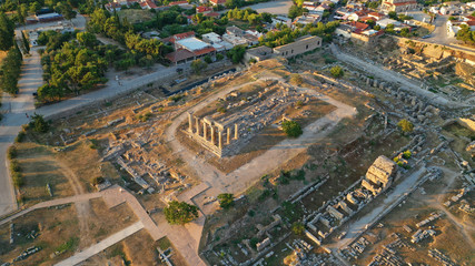Fototapeta na wymiar Aerial drone photo of iconic archaeological site of Ancient Corinth featuring temple of Apollo built in the slopes of Acrocorinth, Peloponnese, Greece