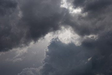 Fototapeta na wymiar Cumulonimbus clouds in the blue sky. Harbingers of rain. Sky pattern. 