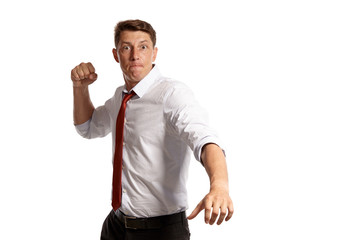 Portrait of a young brunet man posing in a studio isolated over a white background.