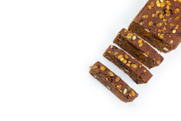Bread with nuts and dried fruits, prunes, dried apricots, raisins and seeds on isolated white background