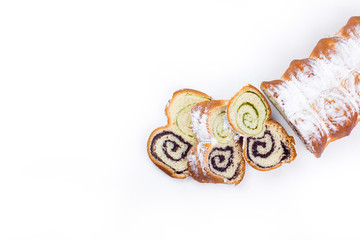 Naklejka premium Fresh sugar loaf of cake with poppies on white isolated background. Healthy organic food concept