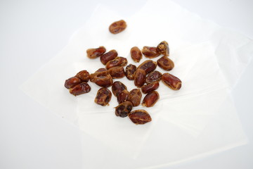 Pile of delicious and fresh dates, sweet and healthy with clean white background