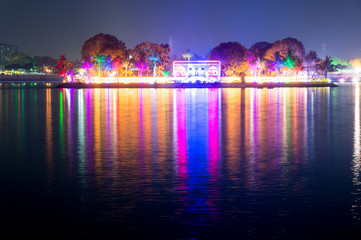 Beautiful and colorful lights reflected in the water of kankaria lake ahmedabad, gujarat