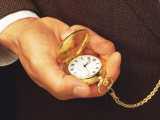 old pocket watch in hand