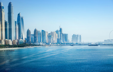 Dubai, UAE United Arabs Emirates. Panoramic view of Dubai skyscrapers at the coast. Skyscrapers and Persian gulf. 