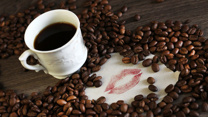 Fresh coffee beans and lipstick lips
