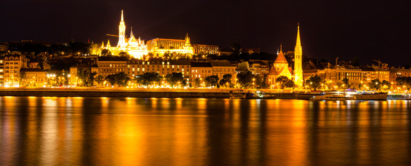 Fototapeta na wymiar Budapest, Hungary - July 9, 2019. Night panorama of Budapest. The view from the embankment to the fishing bastion.