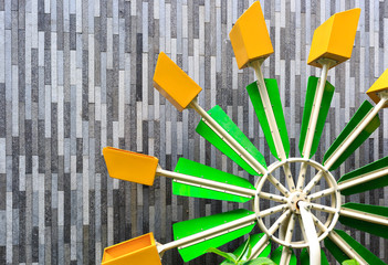 colorful waterwheel toy on playground details facade view