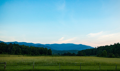 Scenic landscape in a mountain valley at sunset