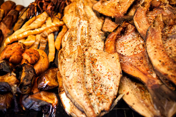 Fresh smoked fish in the market close up shot.